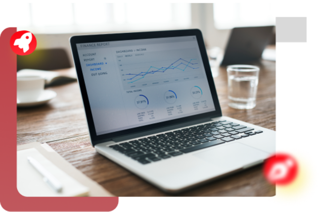 Laptop displaying website design with coffee cup on desk, web development workspace